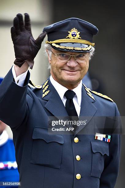 Swedish King Carl Gustaf waves to the public at the Royal Palace in Stockholm on April 30, 2010. Thousands gathered in the Palace courtyard to see...