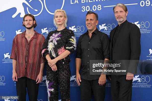 Simon Bennebjerg, Amanda Collin, Director Nikolaj Arcel, and Mads Mikkelsen attend a photocall for the movie "Bastarden " at the 80th Venice...