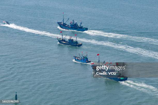 Aerial view of fishing boats setting sail from Jimiya port as the summer fishing ban ended in the Yellow and Bohai seas on September 1, 2023 in...