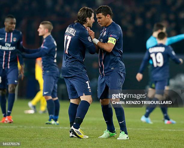 Paris Saint-Germain's Brazilian defender and captain Thiago Silva celebrates with Paris Saint-Germain's Brazilian defender Maxwell after Paris...