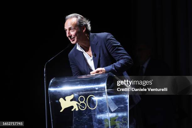 Alexandre Desplat speaks at the Cartier Glory To The Filmmaker Award Ceremony at the 80th Venice International Film Festival on September 01, 2023 in...