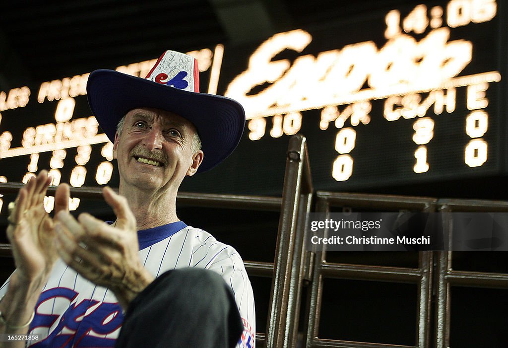 Allan Mansell claps as he watches the Montreal Expos play the Philadelphia Phillies in Montreal, Sep