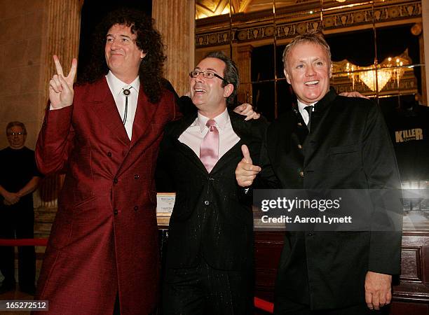 Former Queen guitarist Brian May, writer Ben Elton, and Queen drummer Roger Taylor pose on the red carpet at the opening night of the new musical 'We...