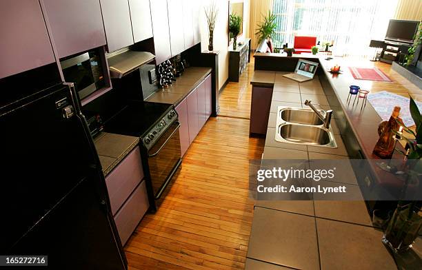 Photos of for 'At Home With. Column of the apartment of former Moxy Fruvous front man and CBC personality Jian Ghomeshi. The kitchen.