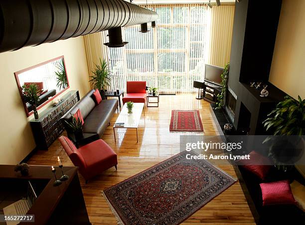 Photos of for 'At Home With. Column of the apartment of former Moxy Fruvous front man and CBC personality Jian Ghomeshi. View of the living room with...
