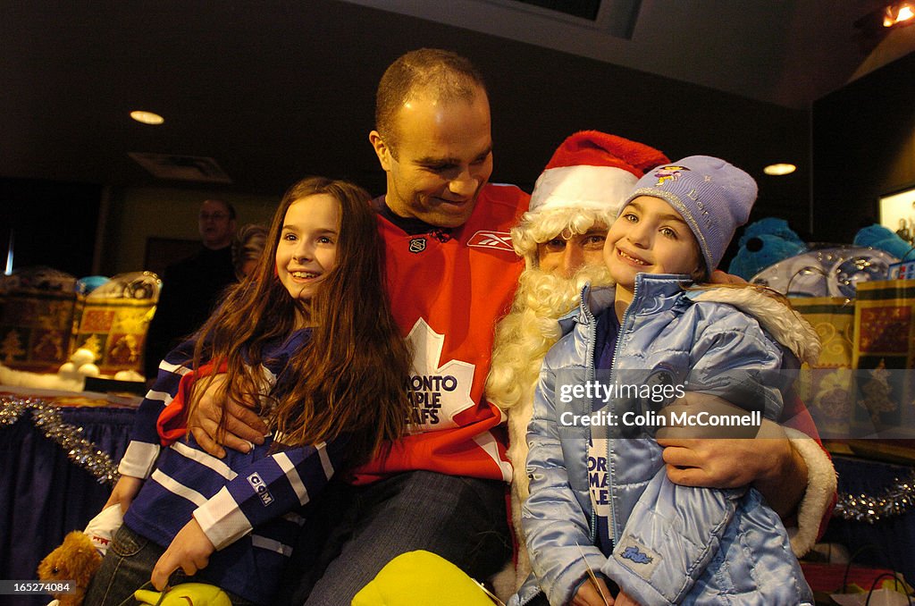 Domi-.12/12/05 pics . of leaf forward tie domi who teamed up with santa claus at the acc to give toy
