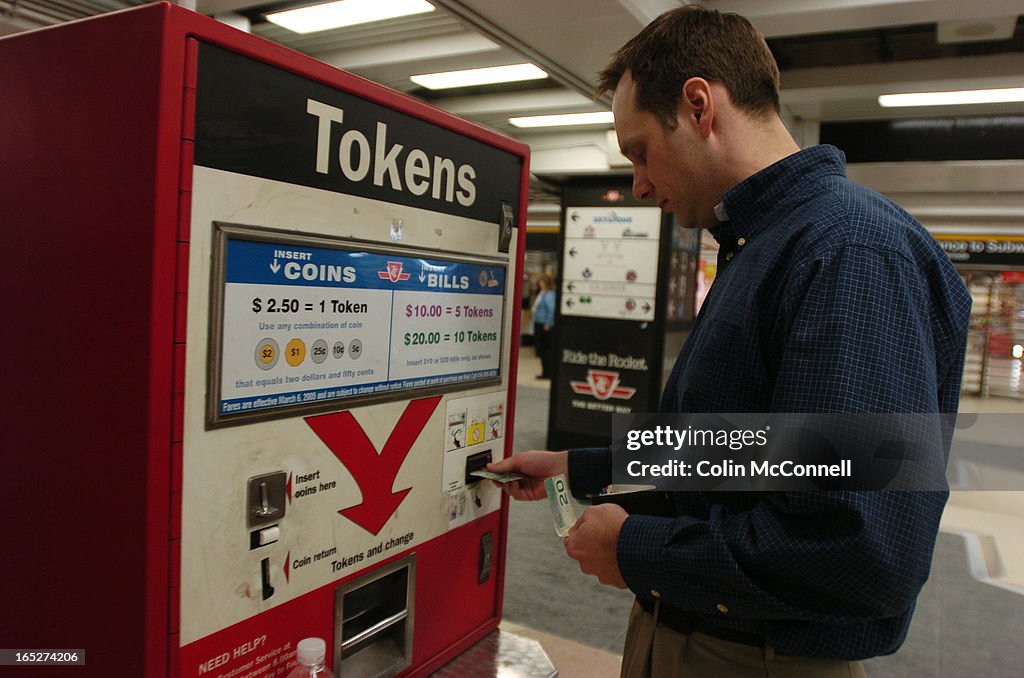 02/08/06- pics of token dispenser at union station ttc subway where people are getting their tokens 