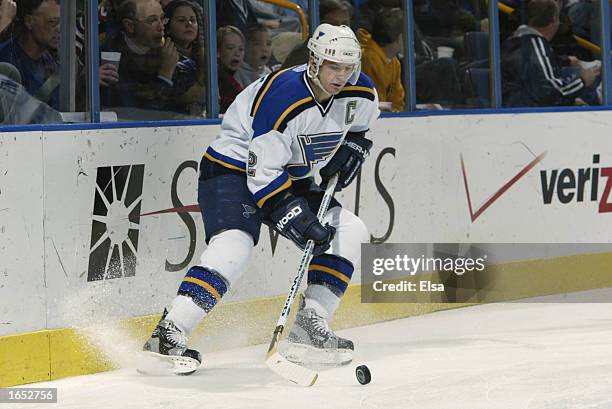 Defenseman Al MacInnis of the St. Louis Blues plays the puck during the NHL game against the Columbus Blue Jackets on November 7, 2002 at the Savvis...