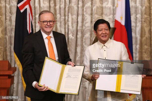 Australia's Prime Minister Anthony Albanese and Philippine President Ferdinand Marcos Jr. Pose for a photo after signing the Memorandum of...