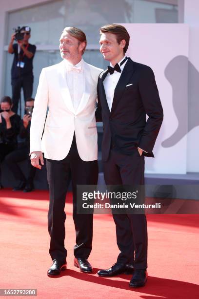 Mads Mikkelsen and Carl Jacobsen Mikkelsen attend a red carpet for the movie "Bastarden " at the 80th Venice International Film Festival on September...