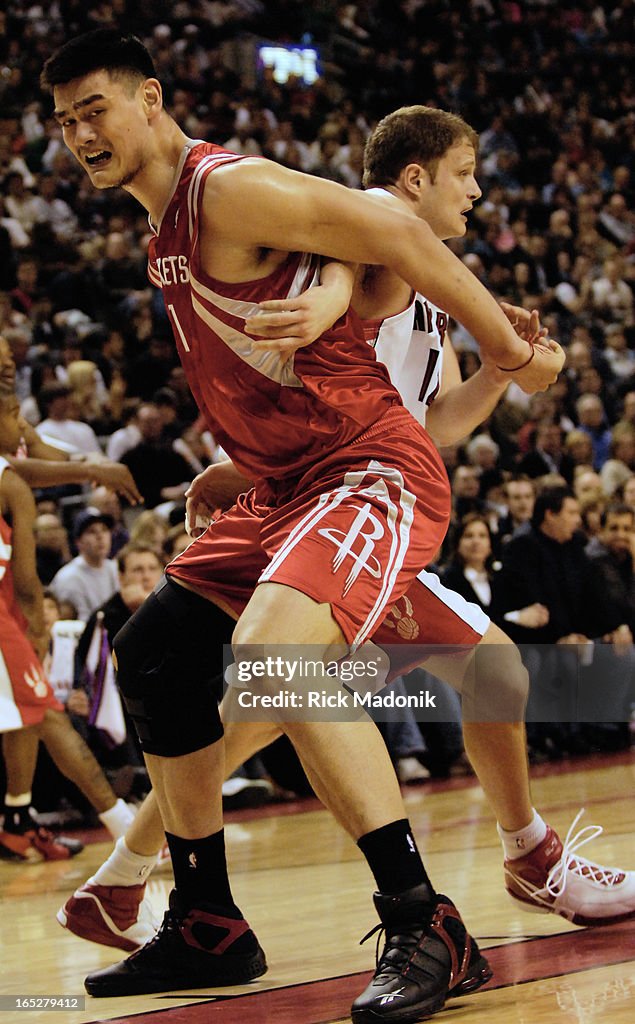 books - 03/16/07 - TORONTO, ONTARIO - Yao Ming battles for reboud ...