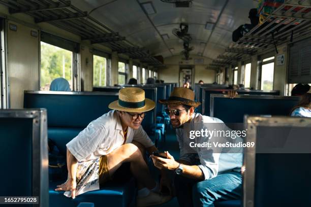 caucasian man tourist travel in thailand on local train. - wanderer stock pictures, royalty-free photos & images