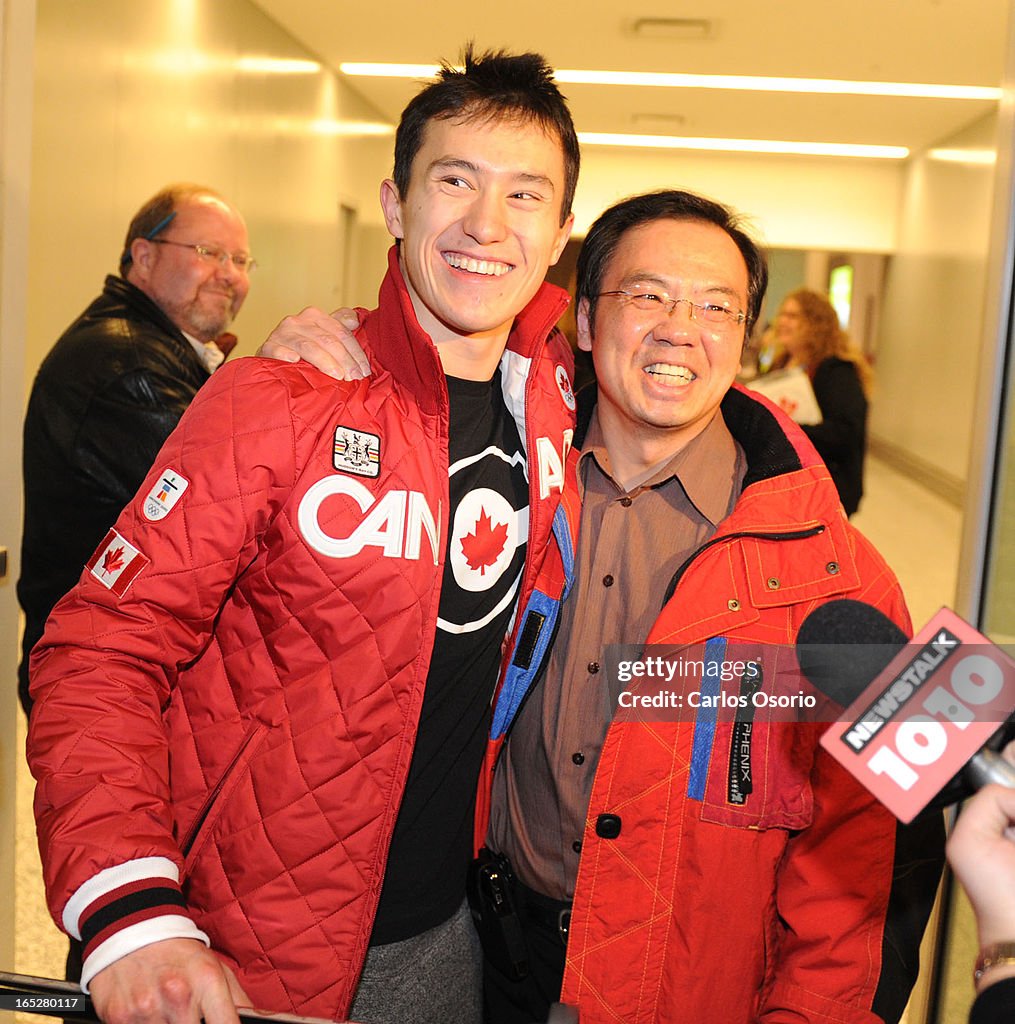 March 1, 2010 -- Olympic Figure Skater Patrick Chan hugs his dad Lewis Chan as he arrives at Toronto