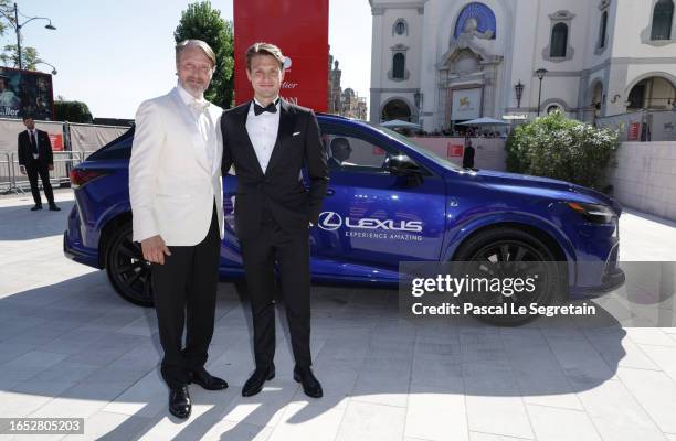 Mads Mikkelsen with his son Carl Jacobsen Mikkelsen arrive on the red carpet ahead of the "Bastarden" screening during the 80th Venice International...