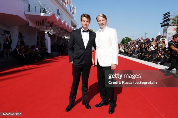 Mads Mikkelsen with his son Carl Jacobsen Mikkelsen arrive on the red carpet ahead of the "Bastarden" screening during the 80th Venice International...