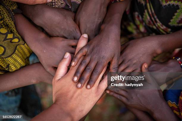 togetherness - social inequality stock pictures, royalty-free photos & images