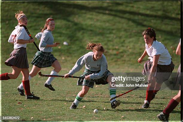 High school field hockey St Pius X High School from Ottawa vs Bishop Strachan School of Toronto . Pius player 23,gets hooked by Strachan player....