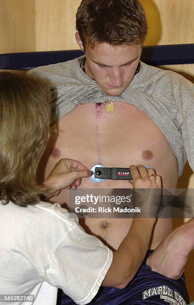 Toronto Maple Leaf prospect Luke Cereda is attached to machinery as he prepares for an aerobic bike test at the Air Canada Centre. Cereda had heart...