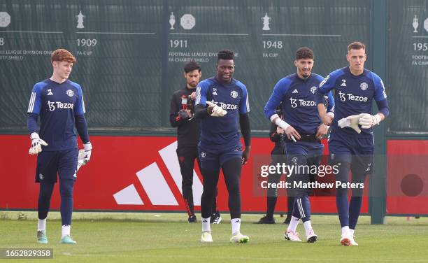 Jacob Carney, Andre Onana, Altay Bayindir, Radek Vitek of Manchester United in action during a first team training session at Carrington Training...