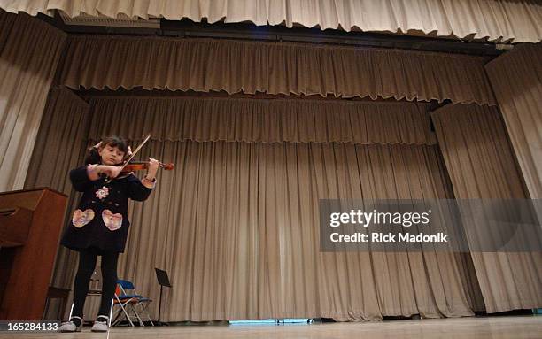 60th edition of Kiwanis Festival with Suzuki violin solo exhibition in the auditorium of Forest Hill Public School. Orli Silverberg is almost lost in...