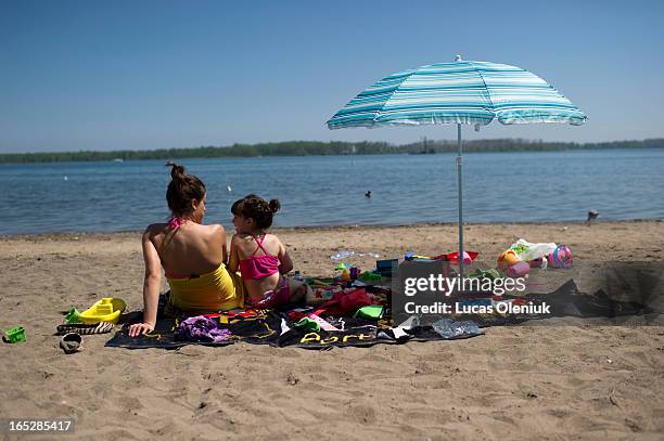 Sofia Martins and her 5-year-old daughter Vanessa sat on Cherry beach eating cherries and feeding birds. They refused to swim in the water that has...