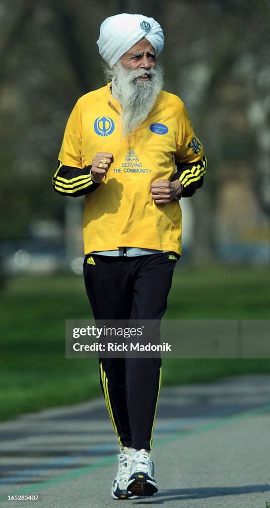 Singh - 05/05/04 - TORONTO, ONTARIO - Fauja Singh, 93, takes a lite jog in Coronation Park. Singh, w