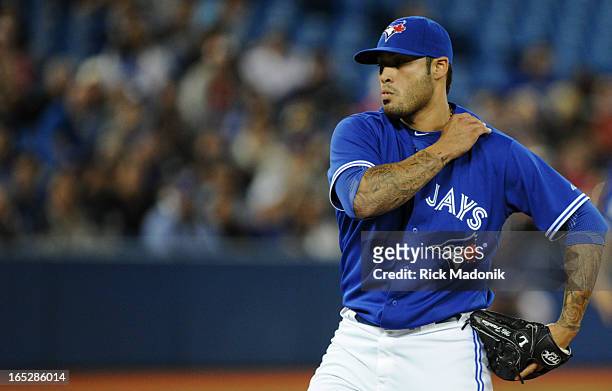 Jays relief pitcher Sergio Santos between pitches after he enters the game betweenToronto Blue Jays and Boston Red Sox at Roger's Centre on...