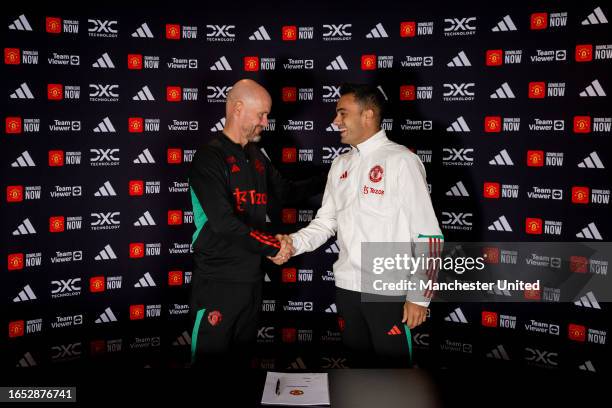 Sergio Reguilon of Manchester United poses with Manager Erik ten Hag after signing for the club at Carrington Training Ground on September 01, 2023...