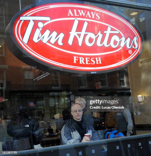 Albert Venczel drank a coffee at the Tim Horton's at Yonge and College Street Monday afternoon. He chose the Canadian coffee chain over the...