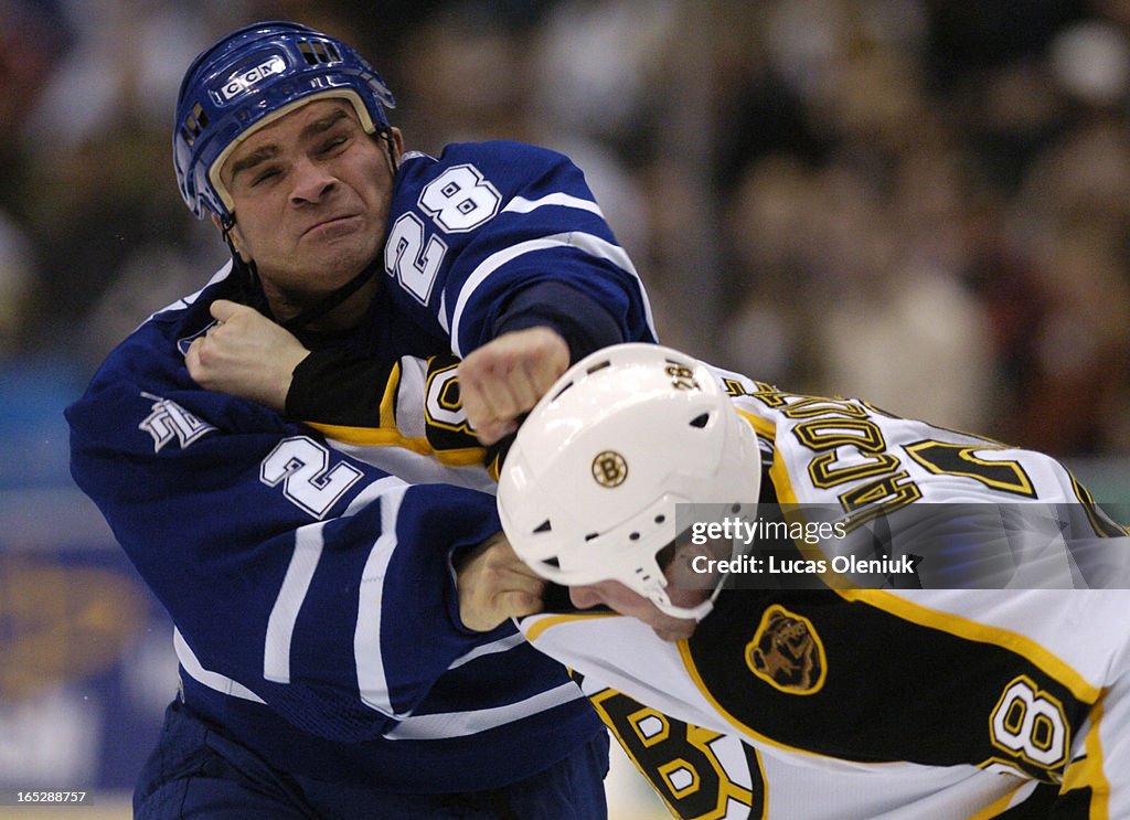 Tie Domi beats on Boston Bruin, Dan LaCouture in the first period of last night's game between the M