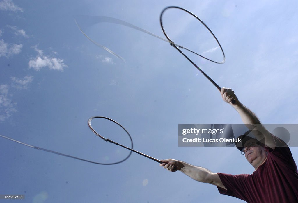 Bullwhip expert, Gerry Comeau, demonstrates a double coachman's crack with a pair of bullwhip's.