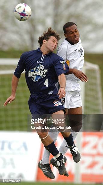 Midfielder Nick DeSantis of the Montreal Impact leaps to head a ball against Ryan Lucas of the Toronto Lynx in the home opening game in which the...