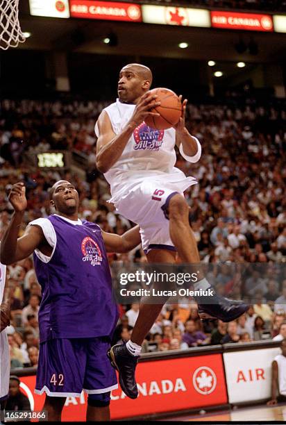 Vince Carter soars to the net in front of a sold out Air Canada Centre at the Second Annual Vince Carter All-Star Charity Game.