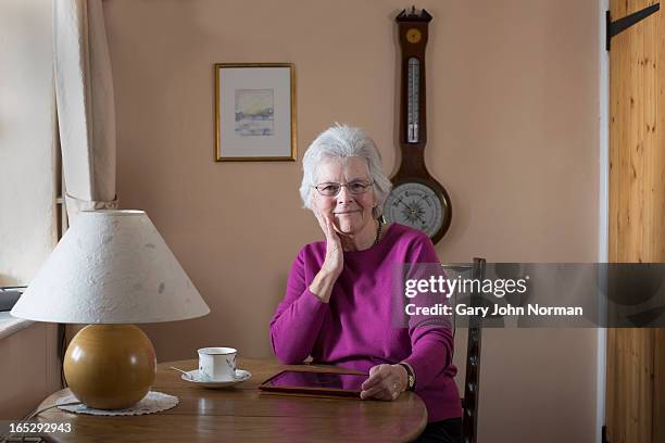 senior woman with digital tablet - norman elder stock-fotos und bilder