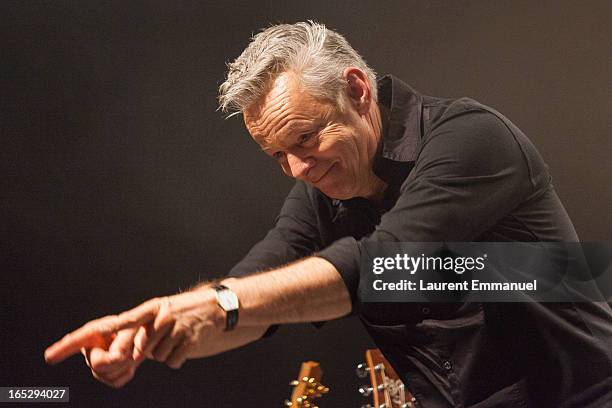 Australian guitarist Tommy Emmanuel acknowledges applause as he performs at La Cigale on April 2, 2013 in Paris, France.