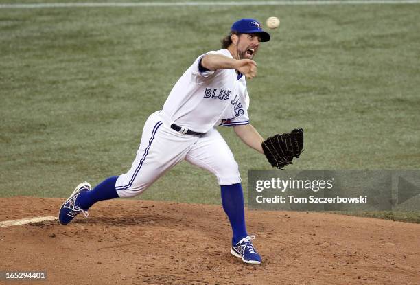 Dickey of the Toronto Blue Jays delivers a pitch during MLB game action against the Cleveland Indians during Opening Day on April 2, 2013 at Rogers...