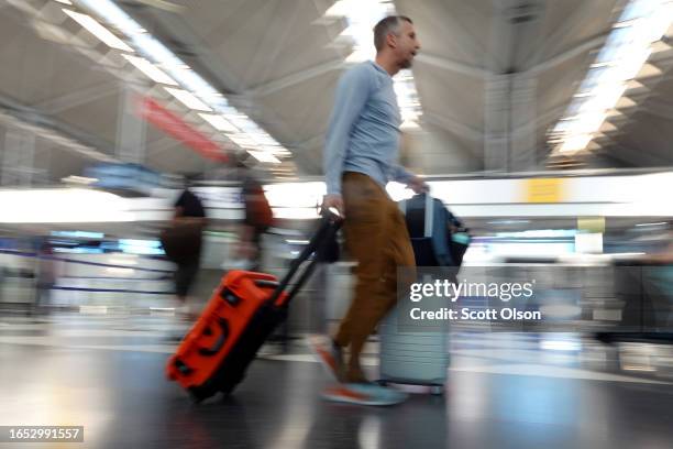 Travelers arrive at O'Hare International Airport for Labor Day weekend travel on September 01, 2023 in Chicago, Illinois. According to AAA, Labor Day...