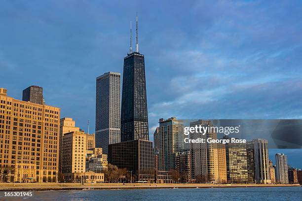 The downtown skyline, including the John Hancock Building and Lakeshore Drive, is viewed from Ohio Street Beach on March 26, 2013 in Chicago,...