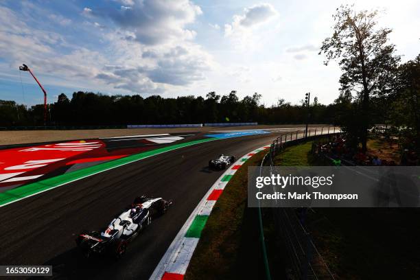 Liam Lawson of New Zealand driving the Scuderia AlphaTauri AT04 and Yuki Tsunoda of Japan driving the Scuderia AlphaTauri AT04 on track during...