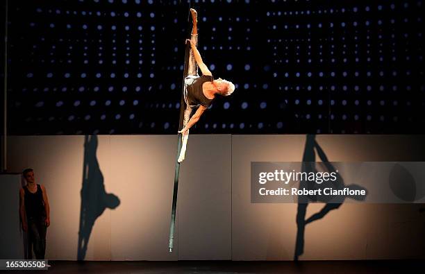 Danny Golding performs on the swinging pole during a National Institute of Circus Arts photo call for 'Leap of Faith: Circus in Motion' at NICA on...