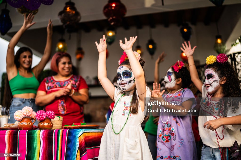 Kids playing and celebrating during day of the death celebration outdoors