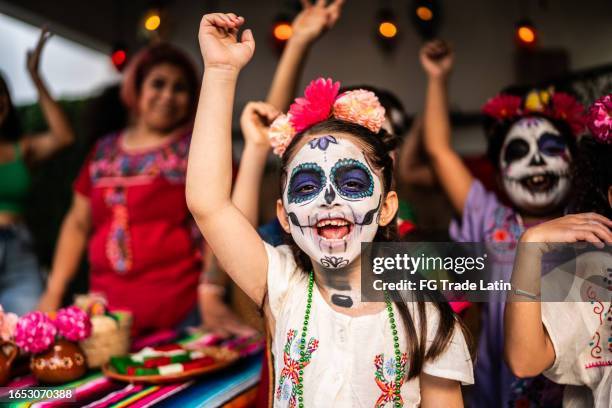 kids playing and celebrating during day of the death celebration outdoors - day of the dead stock pictures, royalty-free photos & images