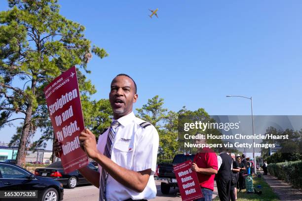 United Airlines flight attendants picket along JKF Blvd. Just outside George Bush Intercontinental Airport as they seek a new contract with the...