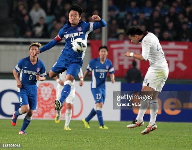 Lu Bofei of Jiangsu Sainty shoots the ball during the AFC Champions League match between Jiangsu Sainty and Buriram United at Nanjing Olympic Sports...