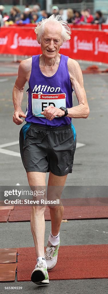 Ed Whitlock, 81, finishes the marathon setting a world record for his age group at the Scotiabank To