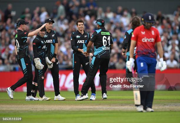 New Zealand bowler Mitchell Santner and team mates celebrate after taking the wicket of Dawid Malan during the 2nd Vitality T20I match between...