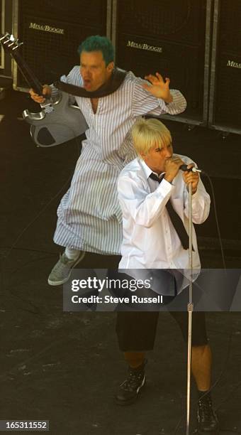 Anthony Kiedis belts out the lyrics while Flea dances behind him during a Red Hot Chili Peppers free concert which attracted 8000 fans to Yonge...