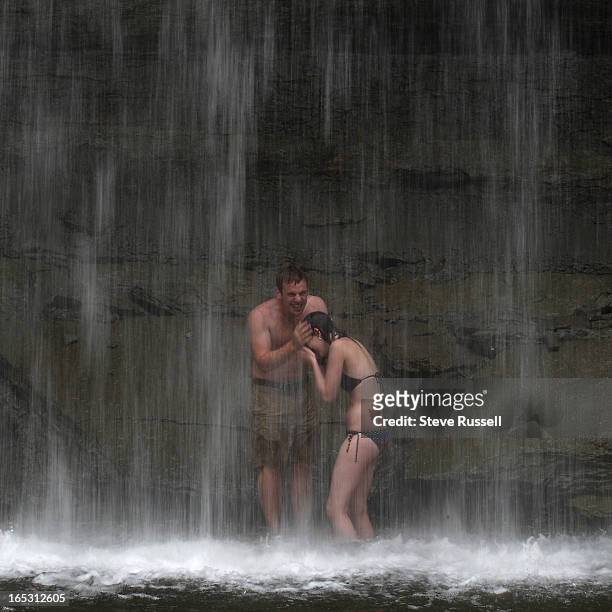 August 22, 2009 Chris Haddad and Sarah Blakely share a laugh under the 10 metre water fall Bridal Veil Falls a very short walk from the Highway 540...