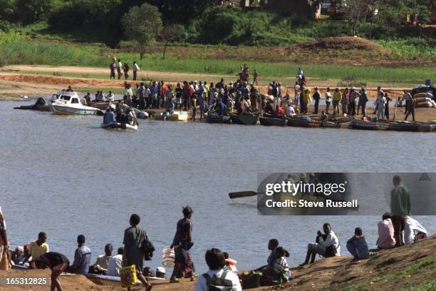 The countries main highway is broken off at the Limpopo Riverjust outside Xai-Xai about 200 km north of Maputo. Commuters must take a boat across the...