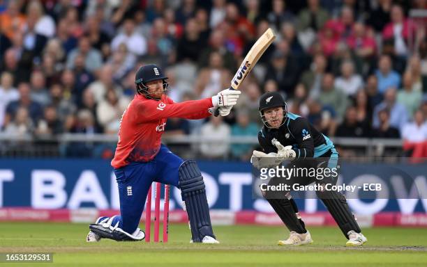 Jonathan Bairstow of England bats watched by New Zealand wicketkeeper Tim Seifert during the 2nd Vitality T20 International between England and New...
